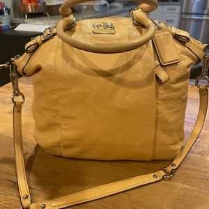 Beautiful Coach carryall. Chrome detail. Hidden front pocket. Great condition.